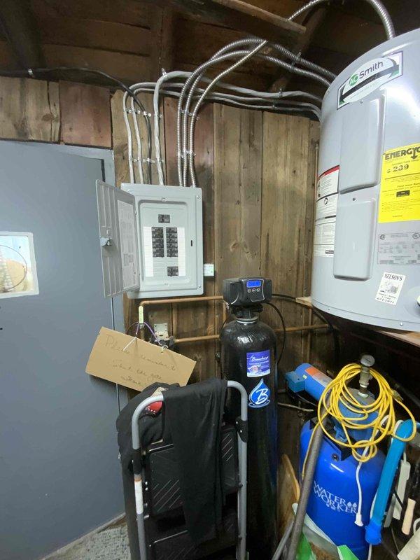 Conducted electrical estimate for new whole home generator installation at manufactured home. Assessed existing 200-amp electrical panel, available breaker capacity, and utility room infrastructure to determine feasibility and requirements for generator integration. Documented current electrical service configuration, panel accessibility, and optimal placement considerations for future generator equipment and automatic transfer switch installation.