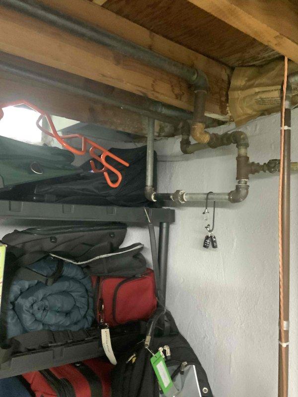 Conducted site assessment for whole house generator installation at 1960s-era single-family residence with existing 100-amp electrical service. Evaluated basement utility area and structural framework to determine optimal generator placement, transfer switch location, and electrical service upgrade requirements. Inspected existing electrical panel capacity, gas line accessibility, and clearance requirements for Generac or Kohler generator installation. Documented structural conditions including exposed joists, existing plumbing infrastructure, and available space for equipment installation to develop comprehensive installation estimate.