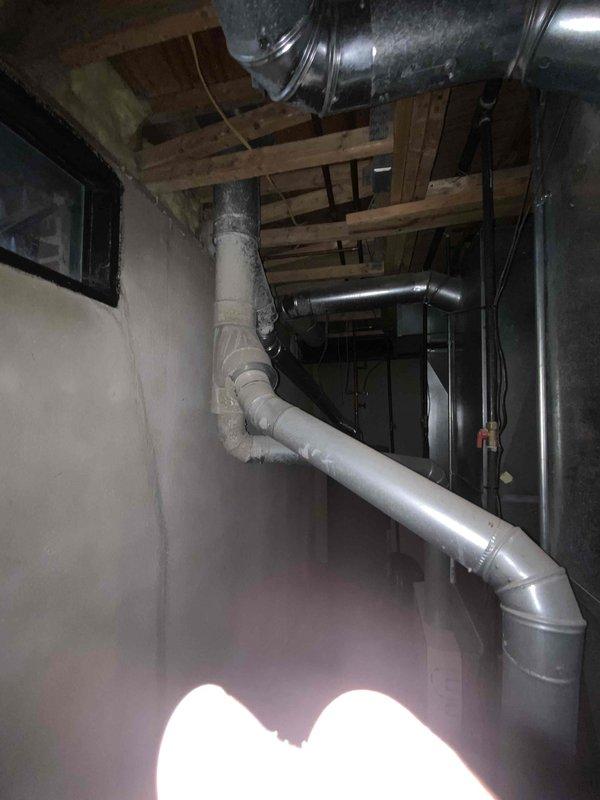 Provided estimate for replacement of non-operational second-floor air conditioning unit, approximately 20+ years old and believed to be 3-ton capacity. Assessed existing ductwork installation in basement area and documented current equipment conditions including cabinet interior and distribution system configuration.