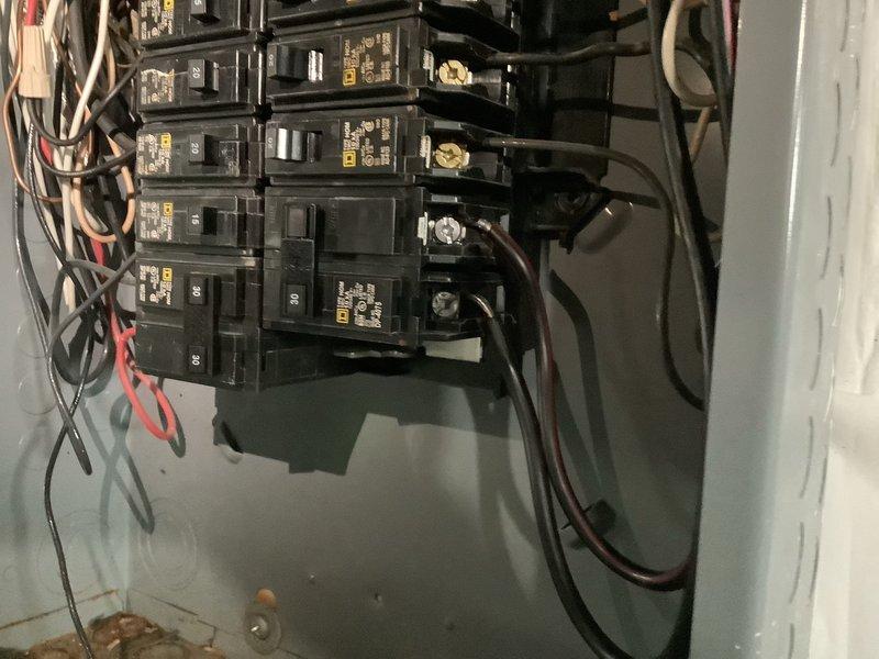 Responded to no cooling complaint on 4-year-old Goodman system with unit running continuously but failing to reduce indoor temperature from 78°F to setpoint of 74°F. Performed comprehensive system diagnostic including inspection of electrical panel, circuit breakers, and wiring connections to identify root cause of cooling failure. Documented electrical components and breaker configuration for further analysis and resolution of ongoing service issues at this location.