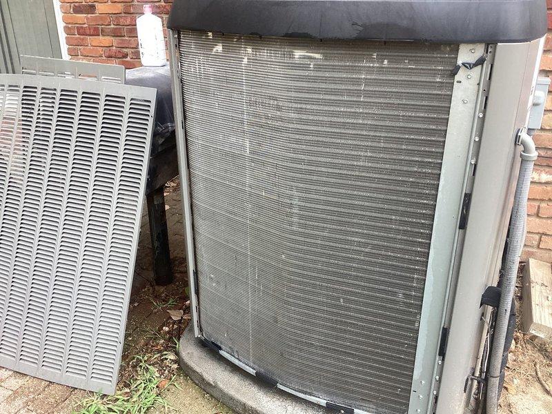 Responded to service call for 5-year-old air conditioning system that was producing a whining noise during operation and had been shut down by occupant. Performed diagnostic inspection of outdoor condenser unit located against exterior brick wall and basement equipment. Identified failed component requiring parts replacement, completed repair under parts warranty coverage, and restored system to normal operation.