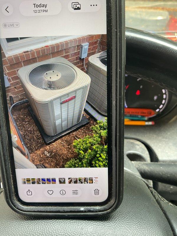 Completed callback to reposition 2-ton air conditioning condenser unit 90 degrees to conceal service ports and manufacturer labels from front-of-building view. Disconnected refrigerant lines and electrical connections, rotated unit on pad, and reconnected all components. Verified proper operation of outdoor condenser unit serving 70K BTU furnace system with evaporator coil, confirmed all connections secure and unit running within manufacturer specifications.