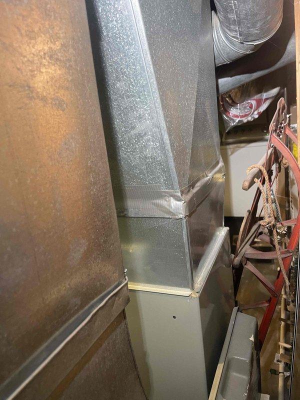 Provided comprehensive estimate for complete furnace and air conditioning system replacement in basement location. Existing 20+ year old R22 system operating poorly with suspected refrigerant leak. Current equipment includes natural gas furnace with extensive ductwork and electrical service panel showing dedicated circuits for HVAC equipment. Assessed existing infrastructure including insulated supply ductwork, electrical capacity, and mechanical room layout to determine replacement specifications and installation requirements.