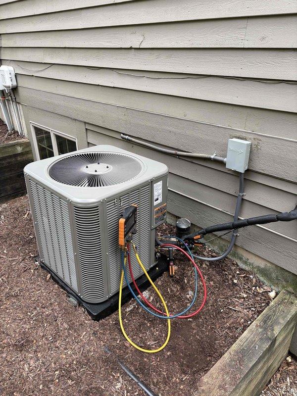 Successfully completed installation of 4-ton air conditioning system with matching evaporator coil at residential property. Outdoor condensing unit positioned on right side yard against exterior wall on concrete pad, with electrical disconnect and conduit properly installed per code requirements. Indoor evaporator coil installed and system reconnected to existing ductwork. Refrigerant lines charged and pressure tested to manufacturer specifications. Sensi programmable thermostat installed and configured for system operation. All electrical connections completed, system startup performed, and unit tested for proper cooling operation and airflow.