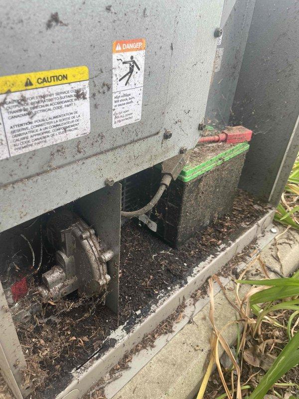 Responded to service call for Kohler generator that failed to start during power outage. Upon arrival, discovered significant debris accumulation throughout the generator cabinet, including decomposed organic matter, soil, twigs, and plant material that had collected over an extended period. The debris had infiltrated critical compartments and surrounded key components including the blower housing and motor assembly. Thoroughly cleaned all affected areas, removing accumulated dirt, leaves, and organic debris from interior compartments, base channel, and surrounding concrete pad. Inspected electrical components and connections for damage or contamination caused by debris infiltration. Verified proper operation of all mechanical systems and conducted startup test to confirm generator functionality was restored.
