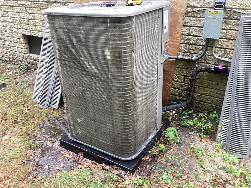 Responded to service call for one-year-old system displaying error code ID 39 with "service urgent" message on thermostat. Located basement-installed equipment and outdoor condenser unit. Upon inspection, found condenser unit with significant dirt, debris, and organic matter accumulation on exterior cabinet and coil surfaces, which can restrict airflow and impact system performance. Documented equipment condition with photographs showing heavy contamination on condenser panels and surrounding area. Addressed error code and verified system operation. Both parts and labor remain under manufacturer warranty coverage.