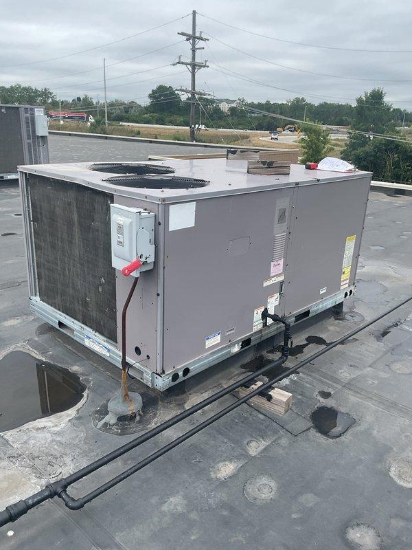 Completed comprehensive estimate assessment for commercial HVAC system replacement including two rooftop package units and one mini-split system. Accessed rooftop equipment through interior hatch, conducted thorough visual inspection and documentation of existing RTU conditions, evaluated electrical disconnects, conduit routing, roof curb adapters, and overall equipment placement for replacement planning purposes.