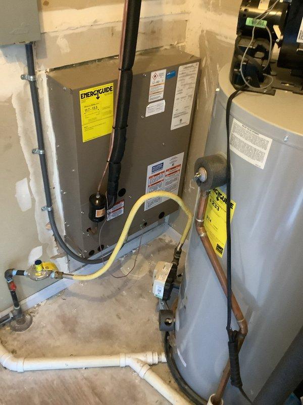 Conducted final diagnostic assessment of existing HVAC system installation to evaluate equipment sizing and performance adequacy. Documented current air handler unit, furnace configuration, and associated ductwork layout with detailed photographic records showing system specifications, energy ratings, and mechanical connections. Reviewed installation setup including PVC drainage lines, electrical connections, and duct transitions to determine compatibility with current heating and cooling load requirements. Consulted with team to establish recommendations for next steps regarding potential system modifications or equipment upgrades based on observed capacity and operational parameters.