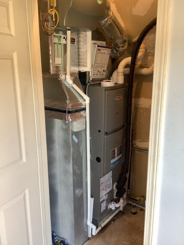 Conducted final diagnostic assessment of existing HVAC system installation to evaluate equipment sizing and performance adequacy. Documented current air handler unit, furnace configuration, and associated ductwork layout with detailed photographic records showing system specifications, energy ratings, and mechanical connections. Reviewed installation setup including PVC drainage lines, electrical connections, and duct transitions to determine compatibility with current heating and cooling load requirements. Consulted with team to establish recommendations for next steps regarding potential system modifications or equipment upgrades based on observed capacity and operational parameters.