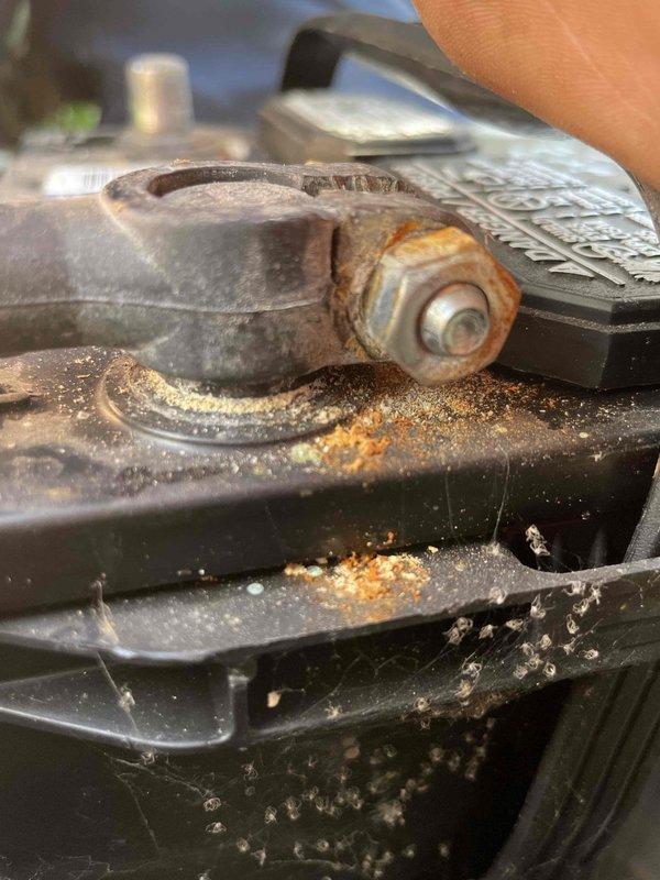 Responded to a Generac standby generator that failed to activate during a recent power outage. Unit had not received regular maintenance since homeowner acquired the property, with unknown service history and no records of kilowatt rating. Performed comprehensive diagnostic evaluation and preventive maintenance service to identify failure cause and restore automatic transfer functionality. Inspection revealed significant corrosion on mounting hardware and fasteners, along with heavy dust and debris accumulation throughout the unit's internal components, including the cooling system heat exchanger fins. Documented deteriorated conditions with photographic evidence showing oxidation on critical mechanical components and latch mechanisms. Addressed maintenance deficiencies and evaluated transfer switch operation to determine root cause of activation failure during utility power loss.