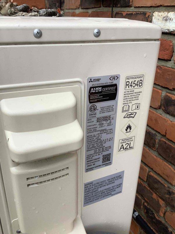 Conducted site evaluation for new whole home generator installation, assessing both Kohler and Generac system options. Inspected existing electrical infrastructure including main service panel with dual column breaker configuration serving all household circuits. Documented current HVAC equipment location on exterior brick wall to determine optimal generator placement and clearance requirements. Evaluated electrical panel capacity and available circuits to establish transfer switch integration requirements for whole home backup power system. Photographed electrical panel labeling showing all protected circuits including HVAC, kitchen appliances, lighting, garage, bedrooms, and bathrooms to determine critical load calculations for generator sizing.