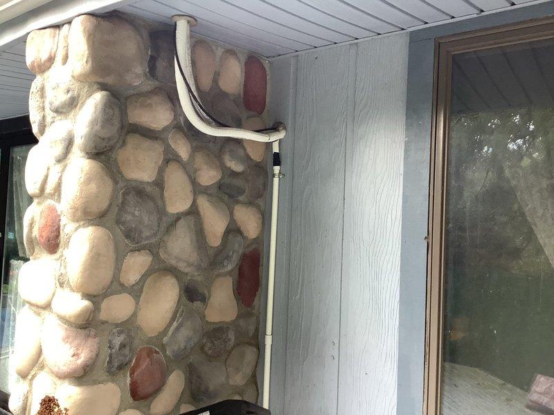 Responded to service recall for reported severe leaking from mini split system. Upon arrival, inspected indoor wall-mounted unit and outdoor condenser for source of water leakage and assessed overall system operation. Examined air filters and found damaged screens with holes requiring replacement. Performed exterior condenser cleaning by hosing off outdoor unit to remove debris and improve heat exchange efficiency. Evaluated system heating capacity concerns related to performance below 35°F ambient temperature and documented undersized equipment for customer's heating load requirements.