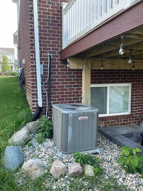 Installed exterior weatherproof electrical outlet on brick wall near existing electrical meter and disconnect panel to accommodate portable generator connection. Ran conduit and wiring from main electrical panel, ensuring proper grounding and code-compliant installation for outdoor generator use.