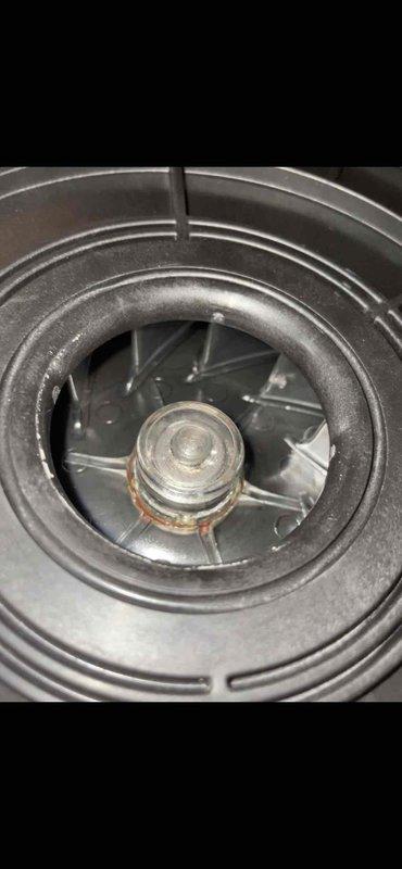 Responded to service call for furnace system located in basement. Upon inspection, discovered rust on heat exchanger presenting a safety hazard. Immediately shut down system to prevent potential carbon monoxide exposure. Documented blower assembly and fan components with photos showing condition of internal components. System remains offline pending heat exchanger replacement, as unit is still under both parts and labor warranty coverage.