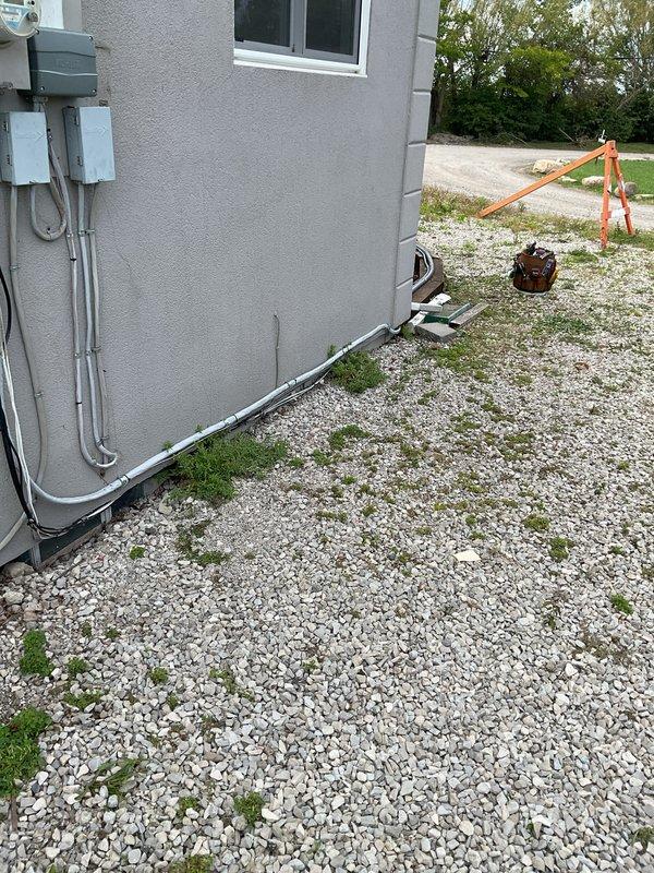 Completed installation of 20kW standby generator with 150-amp automatic transfer switch at residential property. Installed gray electrical conduit from meter box to generator location, positioned unit on gravel pad adjacent to existing HVAC equipment, and established all necessary electrical connections. Secured required permits for mechanical, electrical, generator, and gas piping work prior to installation.