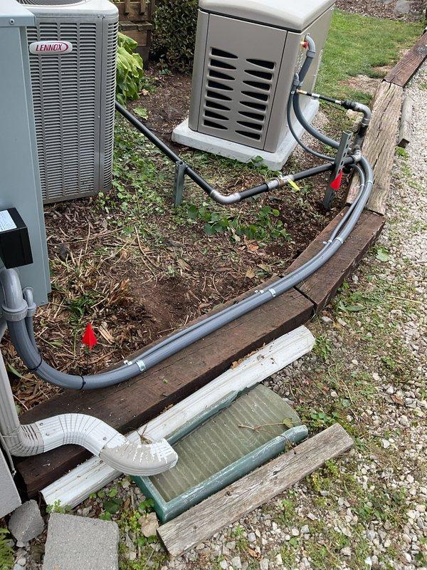 Completed installation of 20kW standby generator with 150-amp automatic transfer switch at residential property. Installed gray electrical conduit from meter box to generator location, positioned unit on gravel pad adjacent to existing HVAC equipment, and established all necessary electrical connections. Secured required permits for mechanical, electrical, generator, and gas piping work prior to installation.