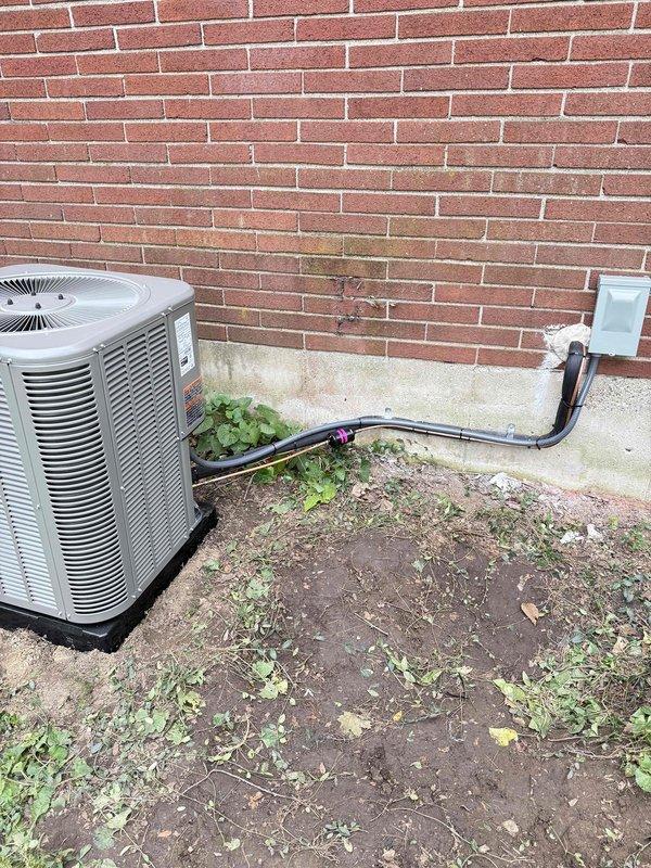 Completed full HVAC system installation including 70,000 BTU furnace with humidifier, 2-ton air conditioning unit with evaporator coil, and electrical reconnection. Installed Lennox condenser unit on exterior pad with refrigerant line set, mounted electrical disconnect box on brick exterior, and completed all mechanical connections. System tested and operational upon completion.