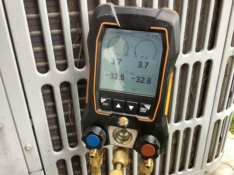Responded to callback for non-operational air conditioning system that had not run since installation. Performed comprehensive diagnostic evaluation of outdoor condensing unit and refrigerant system. Diagnostic testing revealed critically low refrigerant charge with subcooling readings of -32.5°F and -32.8°F, confirming insufficient refrigerant in system as previously indicated by third-party technician.