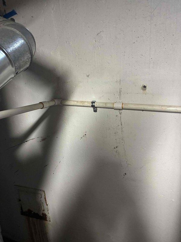 Completed comprehensive plumbing and HVAC system modifications in basement utility area. Reworked entire drain system, connecting into existing 2" PVC line with proper pitch and securing. Corrected furnace and water heater venting configuration using appropriate metallic ductwork and fittings to ensure safe exhaust operation. Removed existing humidifier unit from system. Installed replacement motor for HVAC equipment. All work performed to code with proper pipe supports and duct connections verified for functionality.