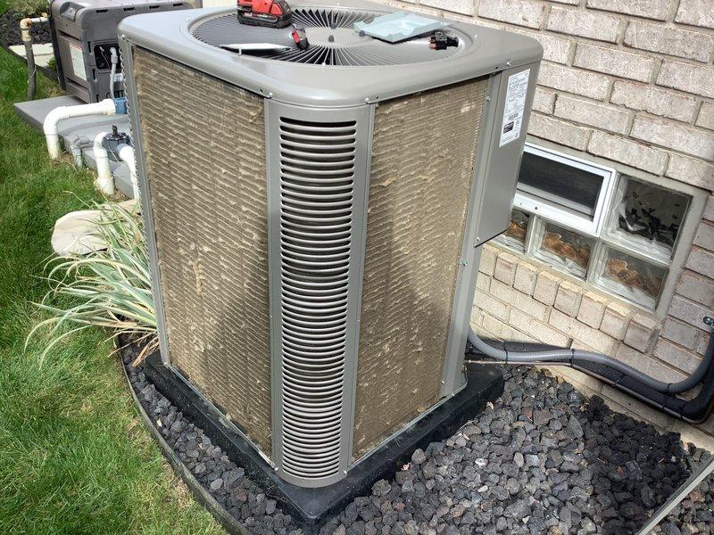Completed comprehensive Air Care Heating and Cooling recurring maintenance service on residential outdoor condensing unit. Performed standard system inspection, verified operational status of all components including condenser coil, fan assembly, and refrigerant service ports, and documented equipment condition through photographic records. Unit found to be in proper working order with adequate airflow, correct mounting on vibration-dampening pad, and appropriate clearances maintained from structure.