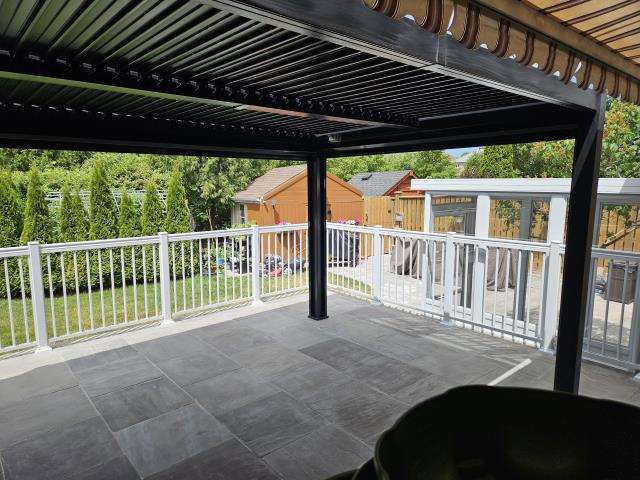 Vaughan, ON - For this returning customer, we previously installed elegant aluminum deck railings that enhanced both the safety and style of their outdoor space. This time, we added motorized zipper system blinds with 3% black fabric. These sleek and functional blinds not only provide shade and protect outdoor furniture from the sun, but also help keep insects out—while offering a touch of privacy for added comfort. Vaughan, ON - For this returning customer, we previously installed elegant aluminum deck railings that enhanced both the safety and style of their outdoor space. This time, we added motorized zipper system blinds with 3% black fabric. These sleek and functional blinds not only provide shade and protect outdoor furniture from the sun, but also help keep insects out—while offering a touch of privacy for added comfort.