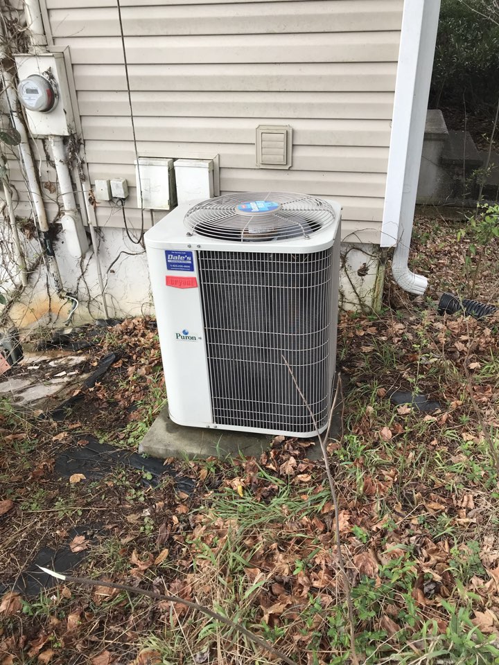 Routine maintenance on a Bryant heat pump.