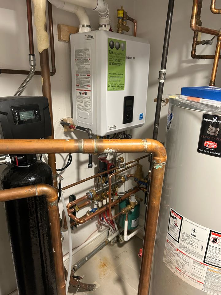 Tdh install new hot water boiler Navien step fire 95%AFUE for radiant heat. Install new primary manifold, recirculation pump, expansion tank, air eliminator, autofill and backflow preventer. New Tekmar thermostat with floor sensor. 