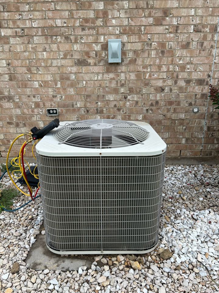 Residential maintenance on HVAC system in Justin, Texas. 