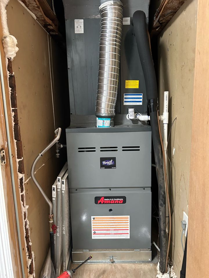Performing HVAC maintenance on a residential system in Rockwall, TX. 