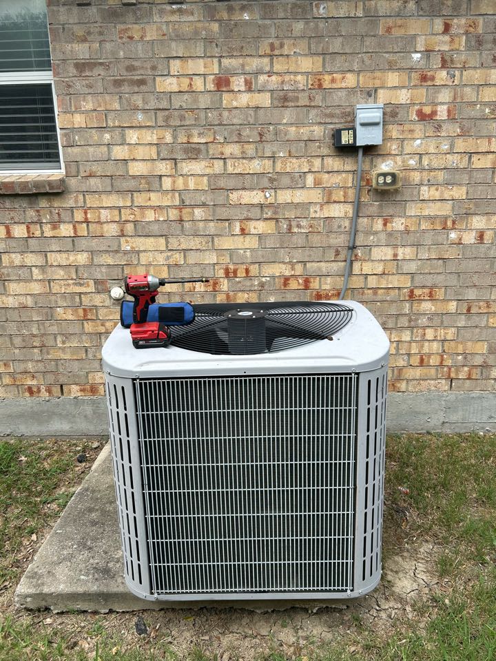 Performing maintenance on a residential HVAC system in Rockwall, TX. 