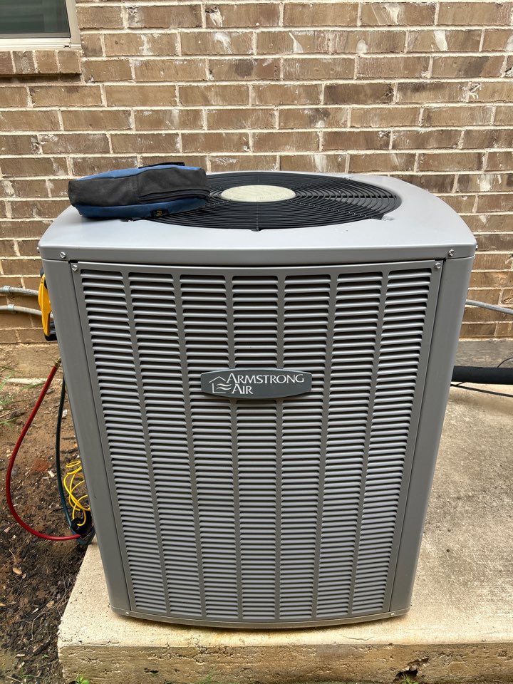 Performing maintenance on residential HVAC system in Lantana. 