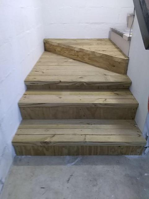 Install landing and steps at base of stairs Install landing and steps at base of stairs