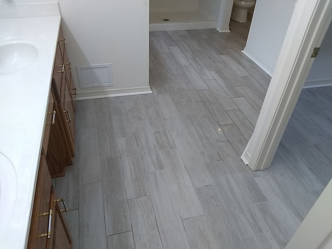 Installed tile floor in master bathroom. Installed tile floor in master bathroom.