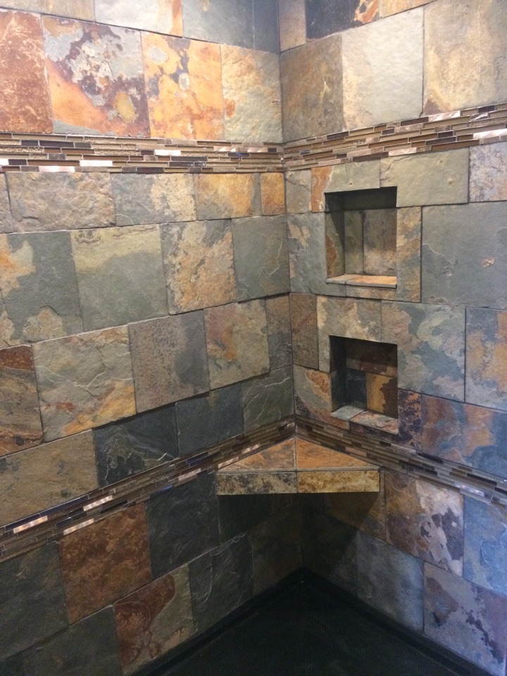 Installed custom slate tile in shower including boarders, two soap/shampoo in sets and corner bench seat. Installed custom slate tile in shower including boarders, two soap/shampoo in sets and corner bench seat.