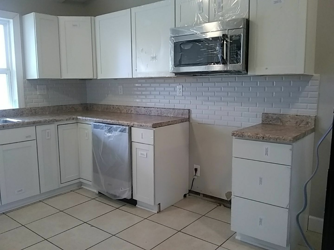 Installed tile backsplash in kitchen. Installed tile backsplash in kitchen.