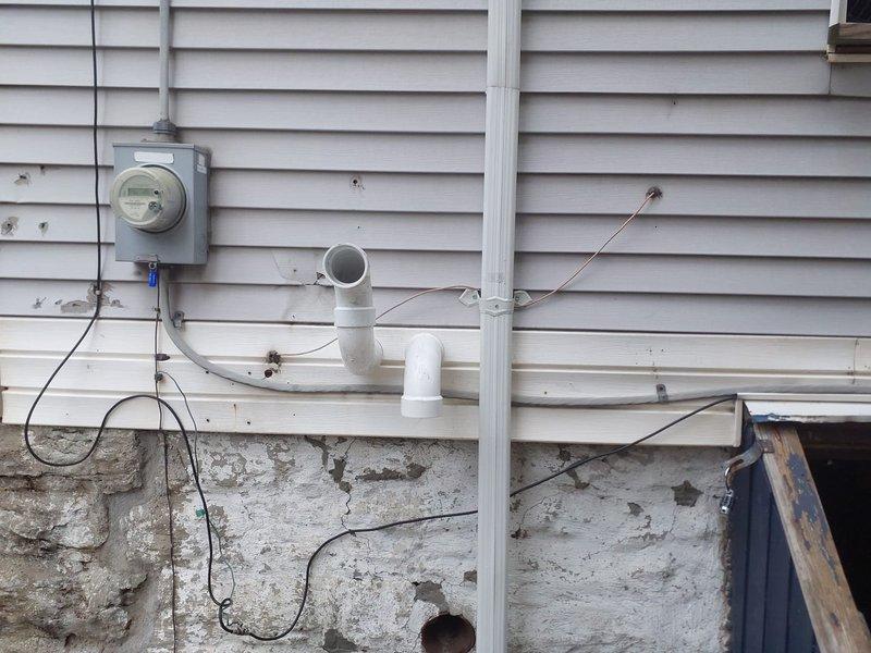 Responded to inspection correction requirements by relocating the union from inside the unit to the exterior as specified. Additionally, rerouted the venting system that was previously discharging onto neighboring property, installing new PVC piping to redirect exhaust to the appropriate side of the building per code requirements.