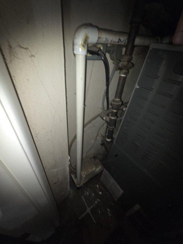 Completed assessment of 3-ton AC system that failed last summer due to damaged evaporator coil and condenser. Documented existing Nest thermostat installation and current plumbing configuration in utility area, noting signs of moisture exposure and aging connections. Provided replacement estimate for complete system.