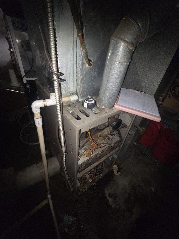 Conducted estimate for commercial furnace replacement. Equipment inspection revealed an aging HVAC system with signs of wear, including possible corrosion on metal components and deteriorating connections. Documented existing setup including ductwork, ventilation, PVC drainage, and electrical connections to ensure proper specifications for replacement unit.