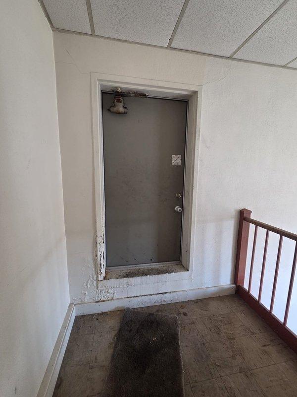 Conducted a commercial HVAC replacement estimate, focusing on a wall-mounted mini-split system. Documented existing conditions including the installation environment and current unit placement near the ceiling with PVC line cover housing refrigerant lines, power, and drainage pipes. Photos were taken to support the estimate documentation for future reference.