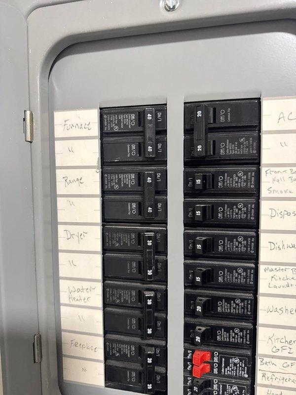 Responded to no cooling complaint at apartment unit. Upon arrival, inspected wall-mounted HVAC unit located in utility closet and verified electrical panel breaker configuration. Documented equipment location and electrical distribution panel with circuit identification for AC system. Photographed unit installation and breaker panel showing proper circuit labeling for furnace, AC, and associated electrical circuits.