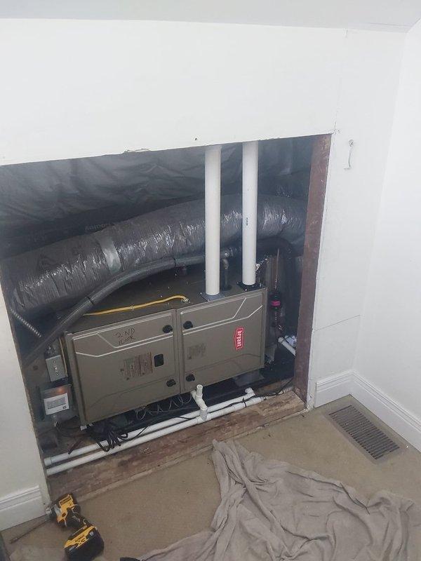 Completed full HVAC system replacement at commercial property including removal and EPA-compliant disposal of existing equipment. Installed new Bryant 3.5-ton split system consisting of GA4SAN542 condensing unit, CVAVA42 evaporator coil, and 912SB42080 80,000 BTU 90% efficiency gas furnace. Relocated furnace from previous location back to attic cubby hole for improved accessibility and space optimization. Ran new refrigerant lineset between outdoor condensing unit and indoor coil, installed new condensate drain pan with proper drainage, and fabricated sheet metal transitions to connect furnace to existing flue system. Mounted condensing unit on new equipment pad with proper gravel base for drainage and stability. Installed electrical disconnect, whip, and fuses for outdoor unit per code requirements. Verified all electrical connections, tested system operation including heating and cooling cycles, and confirmed proper airflow and refrigerant charge. Obtained necessary permit and comple