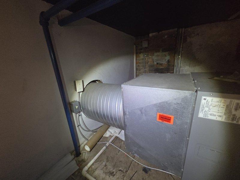 Conducted comprehensive assessment of existing commercial HVAC air handler unit located in basement mechanical room. Documented current equipment configuration including air handler, ductwork connections, PVC condensate drainage system, and proximity to fire suppression piping. Evaluated unit condition, spatial constraints, and mechanical room infrastructure to provide accurate replacement estimate for new commercial air handling equipment.