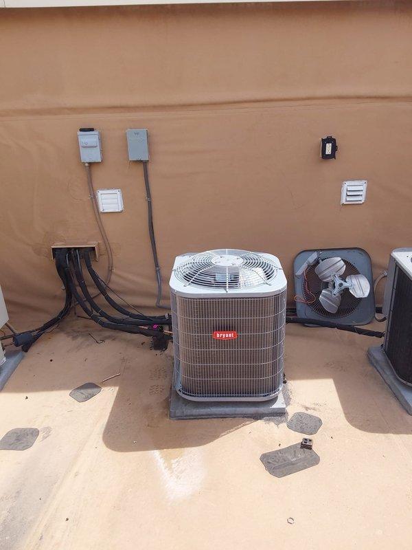Completed full commercial HVAC system installation consisting of model 19HXS08X2UZP000AAF air handler and GA4SAN518 AC condenser unit. Installed Bryant condensing unit on concrete pad with proper leveling and positioning adjacent to existing HVAC equipment. Ran electrical conduit up exterior stucco wall and installed necessary disconnect switches and junction boxes to meet commercial code requirements. Mounted air handler in ceiling plenum space with appropriate access panel for future service. Connected metal ductwork, flexible conduit, and PVC condensate drainage to air handler. Completed all electrical connections including line voltage wiring and control wiring between indoor and outdoor units. Verified proper refrigerant charge, tested system operation, and confirmed all safety controls functioning correctly.