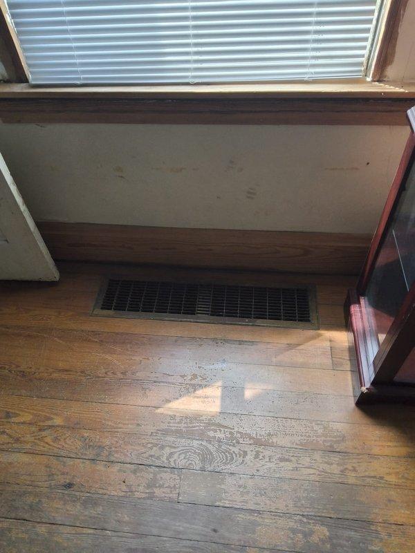 Conducted on-site evaluation for gas furnace and air conditioning system replacement. Assessed existing HVAC equipment, documented current installation location, evaluated floor register placement, and photographed interior space to determine optimal equipment configuration and installation requirements for complete system replacement estimate.