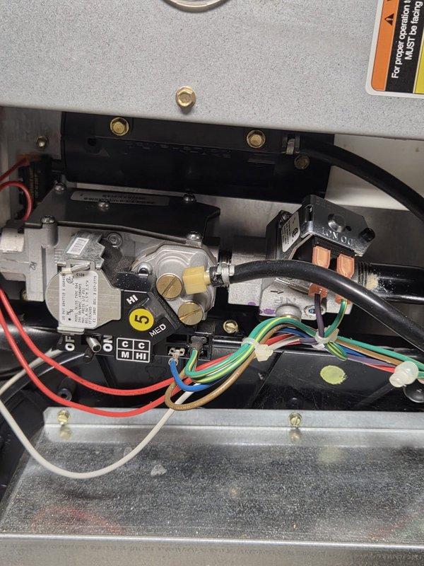 Conducted comprehensive assessment of existing HVAC system for air conditioning replacement estimate. Documented current equipment configuration including gas valve controls, electrical connections, and ductwork installation in mechanical space. Photographed control components, wiring systems, and existing duct infrastructure to provide accurate replacement specifications and equipment sizing recommendations.