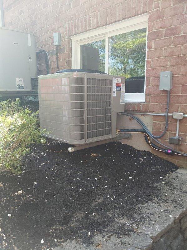 Completed full HVAC system replacement including installation of Bryant 987MC66100C21 Evolution 100,000 BTU gas furnace, 148TAN04800W Preferred 18 SEER2 air conditioner (4.0 tons, two-stage, R454B refrigerant), and CVAVA4821XMA V-coil cased vertical evaporator coil in basement utility room. Performed lineset replacement with nitrogen purge, installed new outdoor disconnect with fuses, and reconnected all utilities including gas line, condensate drain line, and filter rack. Reused existing zoning system, replaced thermostat(s), and installed new Model 501 filter in existing filter rack to complete system commissioning.