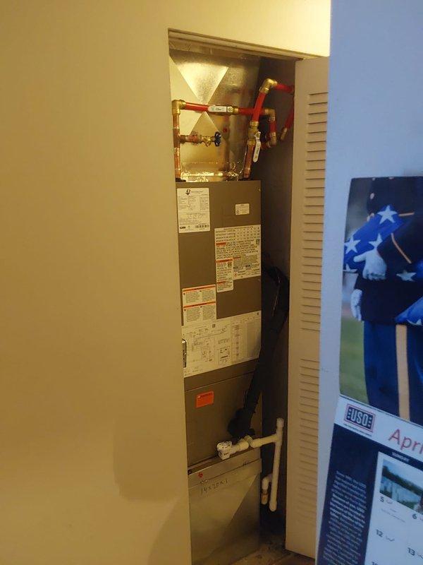 Completed full commercial HVAC system installation including Bryant 2-ton 14 SEER condenser (GA4SAN52400N) rated for R-454B refrigerant and hot water fan coil unit (BCRMA2124S3N3). Installed electrical disconnect with 25-amp fuses, whip and pad, fabricated custom sheet metal to connect to existing supply and return ductwork, and installed return air box with filter rack. Added purge valves to boiler lines, performed complete refrigerant leak check, and properly charged system to manufacturer specifications. Disposed of existing equipment per EPA regulations and utilized crane for rooftop equipment placement. Obtained necessary permit and system is operational.