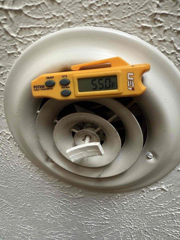 Responded to no cooling complaint following commercial AC installation. Upon arrival, verified thermostat was set to cooling mode with setpoint at 50°F and indoor temperature reading 75°F. Inspected system operation and measured supply air temperature at ceiling diffuser, confirming 55°F discharge air temperature. Checked service valves on outdoor unit that may have been inadvertently left closed during installation. Opened valves to proper operating position, restoring full refrigerant flow to system. System now cooling properly with appropriate temperature differential.