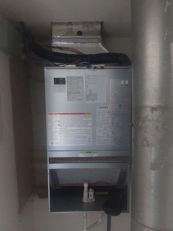 Completed full commercial HVAC system replacement including installation of Bryant FMA5X2400AL R-454B air handler with 8kw electric heat pack and Bryant GA4SAN51800N 1.5-ton 14 SEER condenser utilizing R-454B refrigerant. Flushed and reused existing refrigerant lines, fabricated sheet metal connections to integrate with existing supply and return ductwork, installed outdoor disconnect with whip, pad, and fuses, obtained necessary permit, and disposed of existing equipment per EPA specifications with old unit left on-site per maintenance request.