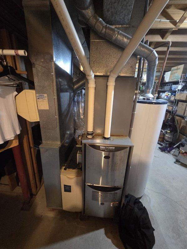 Conducted comprehensive estimate for complete air conditioning and gas furnace replacement system. Assessed existing basement mechanical room installation, documented current HVAC equipment including furnace with stainless steel panel, evaporator coil assembly, and ductwork configuration. Evaluated system components, photographed equipment specifications, and provided replacement options with promotional pricing consideration for dual-unit installation.